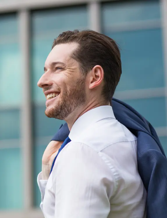 Closeup of Happy Business Man Standing Outside